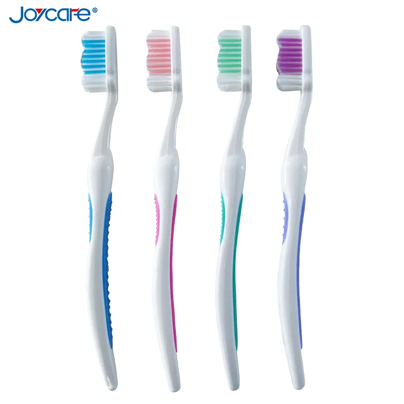Health Care Adult′s Toothbrush/Nylon Wave Bristles/Antislip Soft Rubber Handle