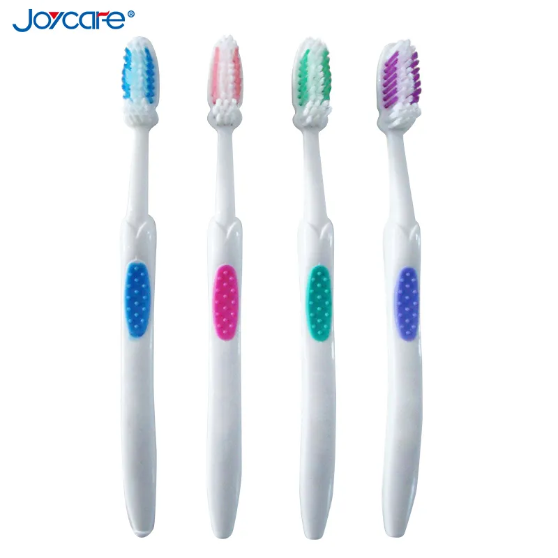 Health Care Adult′s Toothbrush/Nylon Wave Bristles/Antislip Soft Rubber Handle